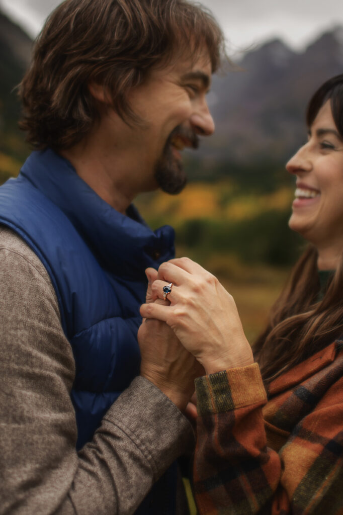 Engagement Photographer, close up of couple looking at each other and holding hands