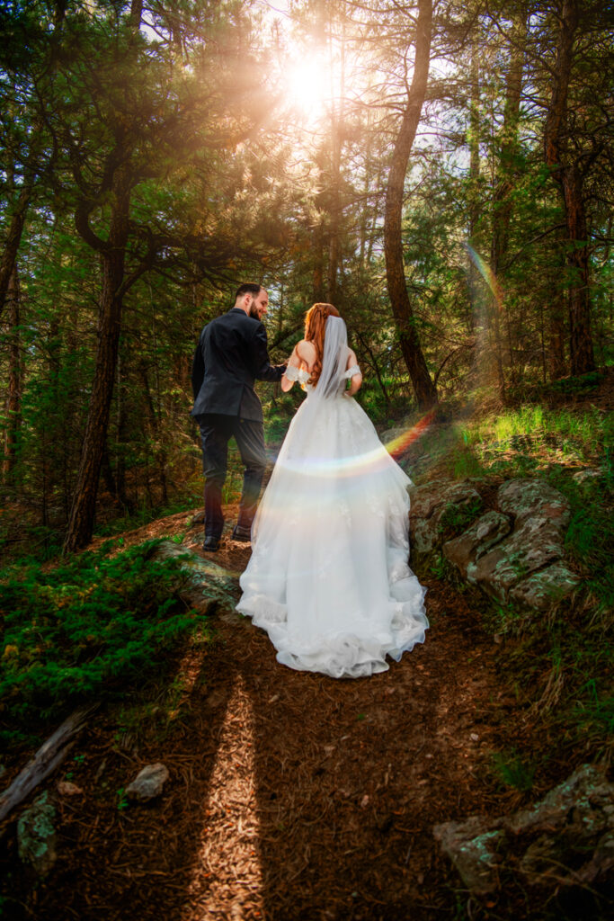 Wedding and Elopement Photography, bride and groom walking through the woods together